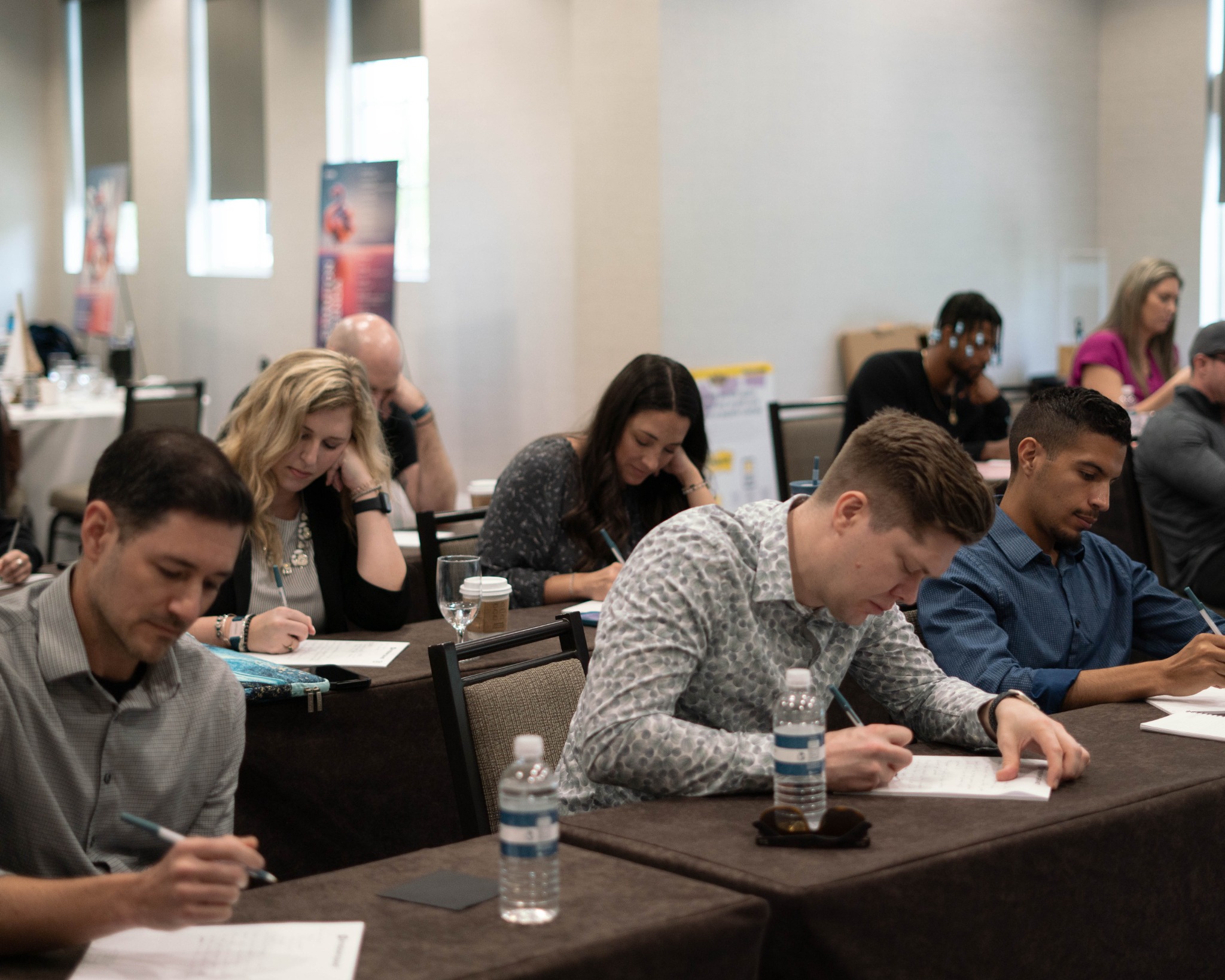 Teams working together during a Chief of Happiness workshop